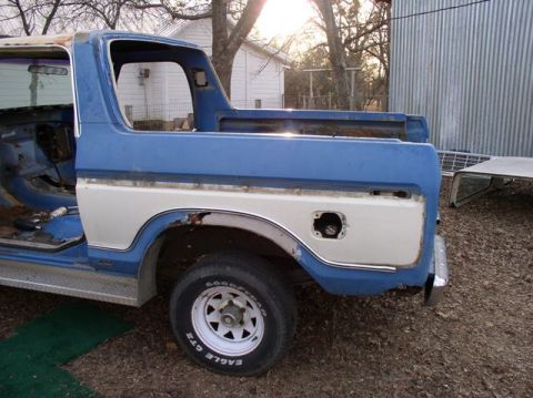 1978 Ford Bronco - This 1978 Ford Bronco is seen from the rear quarter, showing its blue and white paint scheme and missing fuel door.