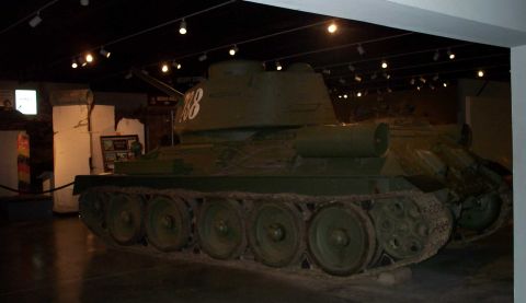 1998 Ford Crown Victoria - Museum exhibit features a Soviet T-34 tank, with another tank visible in the background.