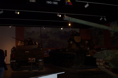 1998 Ford Crown Victoria - A museum exhibit displays several military tanks, with a focus on the rear of a Sherman tank.