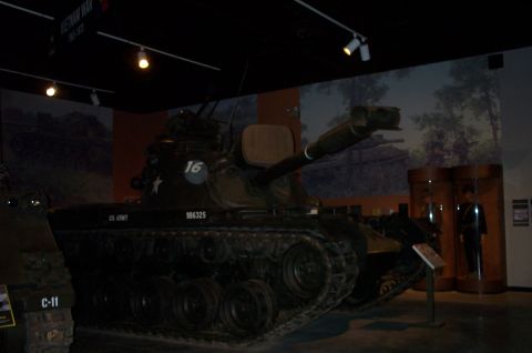 1998 Ford Crown Victoria - Museum exhibit features a military tank, with another tank visible to the left.