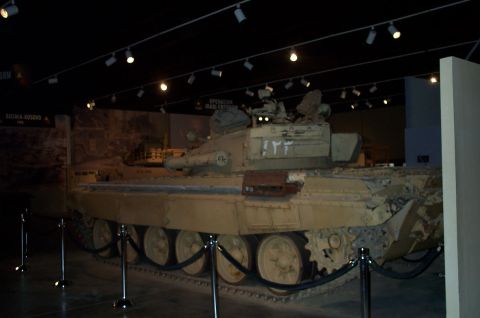 1998 Ford Crown Victoria - Museum exhibit a military tank with Arabic numerals on its side.
