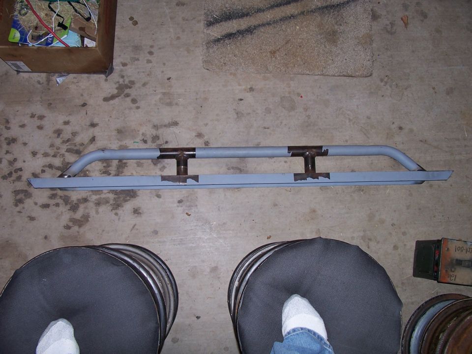 Gray custom rock sliders with two I-beam mounts