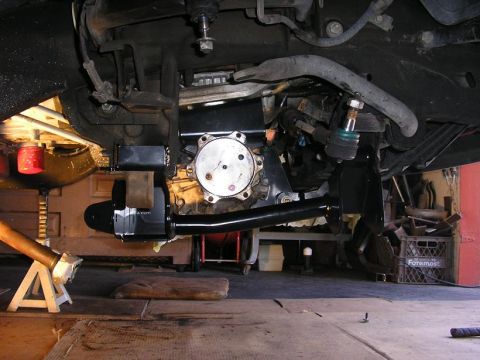 1979 Chevrolet C/K Pickup - Underside view of a vehicle's front suspension and drivetrain, with focus on the differential and steering components.