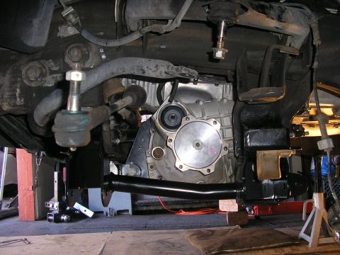 1979 Chevrolet C/K Pickup - Close-up of the vehicle's undercarriage, showing suspension and transmission components.