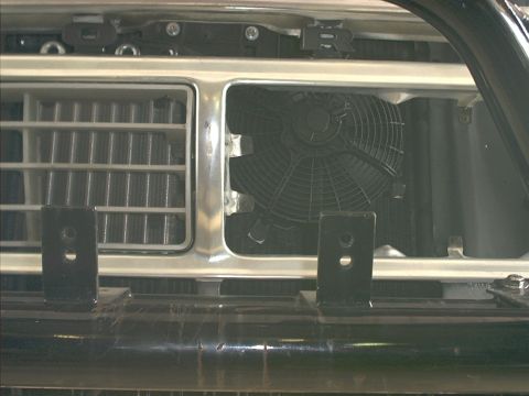 1978 Ford Bronco - Close-up of the 1978 Ford Bronco's front grille and cooling fan.