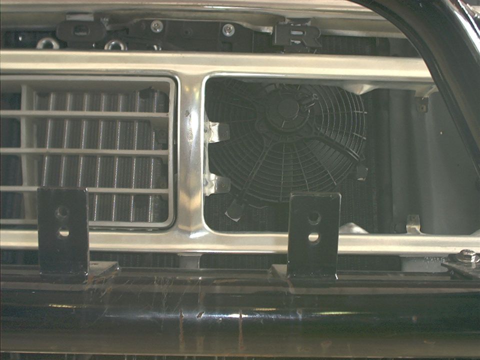1978 Ford Bronco front grille with fan visible behind it