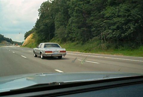 1985 Ford LTD Crown Victoria - Silver 1985 Ford Crown Victoria LTD seen from another car on the highway.
