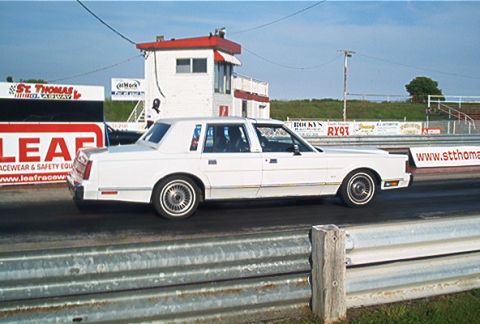 1985 Ford LTD Crown Victoria - White 1985 Ford Crown Victoria LTD at St. Thomas Dragway, seen from the side.
