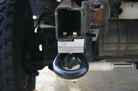 1994 Ford Bronco - An aftermarket tow hook is bolted to the vehicle's frame, ready for towing or recovery operations.
