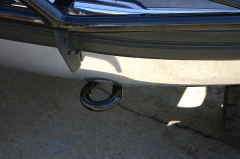 1994 Ford Bronco - Vehicle bumper with a black tow hook installed.