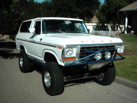 1978 Ford Bronco - This lifted 1978 Ford Bronco features a custom blue front bumper with auxiliary lights and large off-road tires.