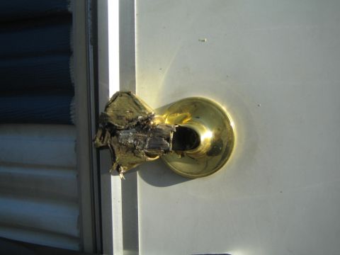 1968 Ford Mustang - The door handle appears to have been damaged by fire or impact, showing significant charring and splintering.