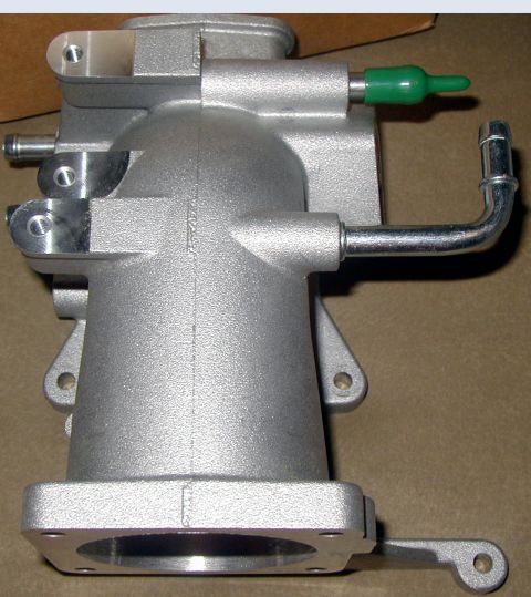 2000 Ford Crown Victoria - Close-up of an aluminum intake manifold part, possibly for a Ford vehicle.