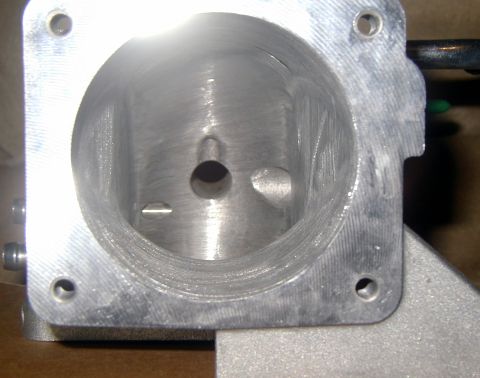 2000 Ford Crown Victoria - Close-up view of an aluminum intake manifold part, showing internal machining details and mounting holes.