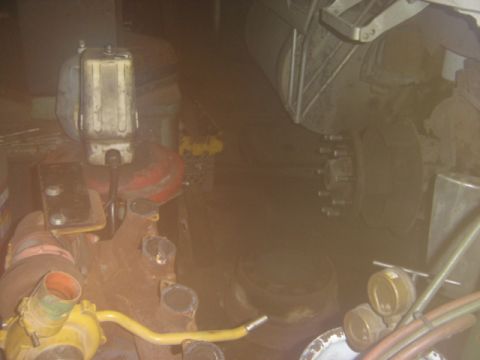 1992 Ford Bronco - This image shows various engine parts and a wheel assembly, not a complete vehicle.