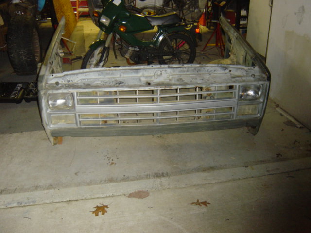 Front clip of a truck, showing the grille and headlights