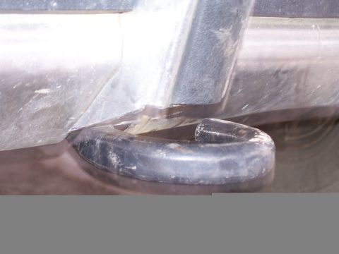 1982 Ford Bronco - Detail of a tow hook on a vehicle's frame.
