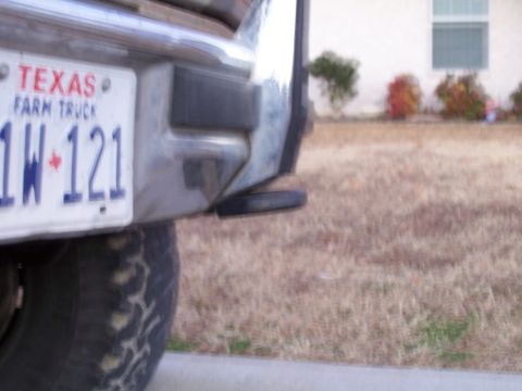 1982 Ford Bronco - Close-up of a Texas Farm Truck license plate on the rear of a vehicle.