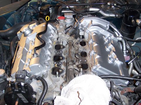 1997 Ford Probe - Close-up view of an engine bay, silver valve covers and various hoses and wires.