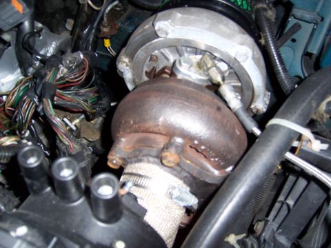 1997 Ford Probe - This image shows a turbocharger assembly with associated engine wiring and plumbing.