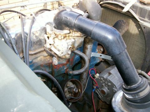1993 Ford Bronco - Angle shot of CJ2A 64 Ford Falcon Holley carb and open top of distributor