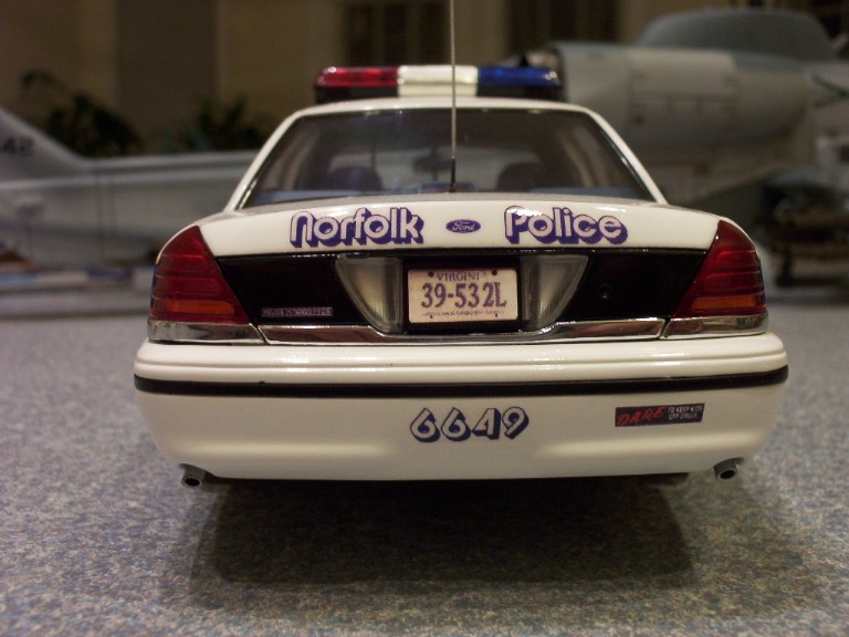 1998 Ford Crown Victoria police car, rear view, white with blue lettering, license plate 39-532L