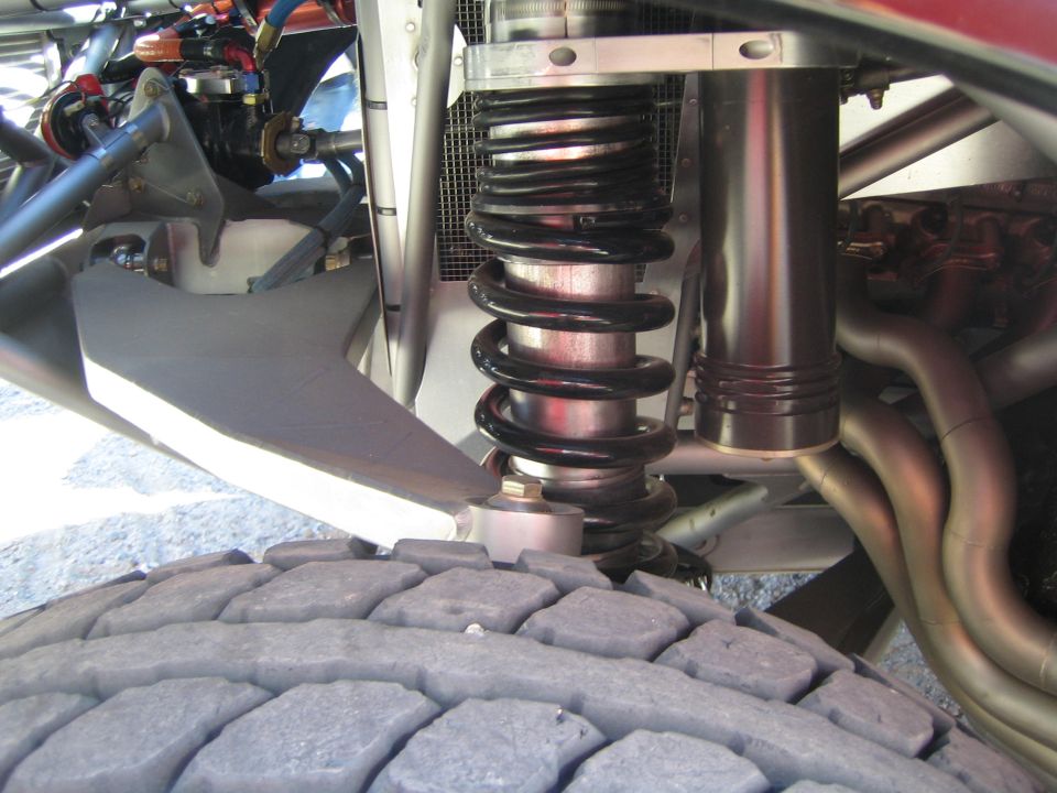 Coilover shock and suspension over an off-road truck tire