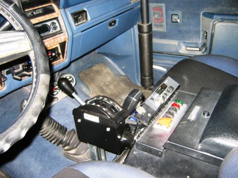 1985 Ford Bronco - Custom shifter and radio console visible in the interior of a vehicle.