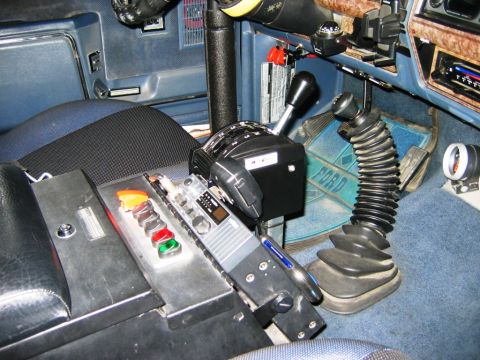 1985 Ford Bronco - Interior view of a 1985 Ford Bronco, a custom shifter and CB radio.