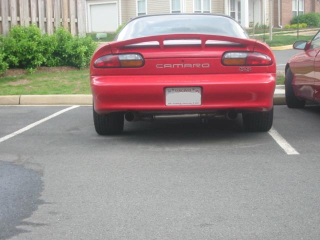 Red 2002 Chevrolet Camaro SS parked in a lot, rear view. Visible SS badge and Virginia license plate