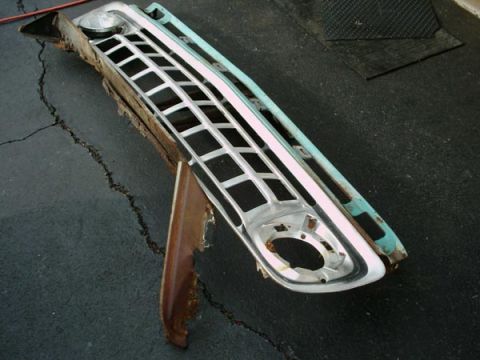 1966 Ford F-250 - This grille assembly, likely from a 1966 Ford F-250, features prominent chrome detailing and headlight bezels.