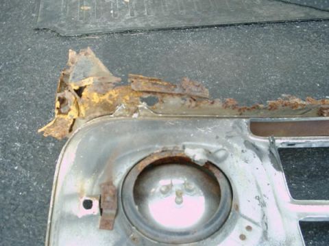 1966 Ford F-250 - Rusted grille section with headlight opening, showing significant corrosion.