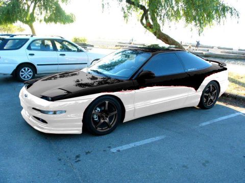 1993 Ford Probe - This 1993 Ford Probe features a two-tone paint scheme and aftermarket wheels.