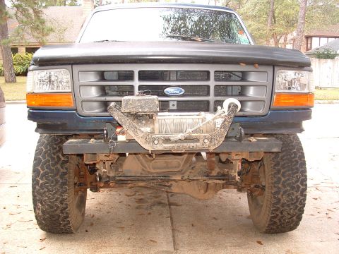 1993 Ford Bronco - This Ford truck features a winch and off-road tires, suggesting it's built for terrain.