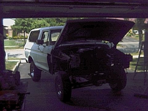 1978 Ford Bronco - This Ford Bronco is undergoing some work with its hood open, revealing the engine bay.