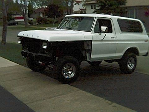 1978 Ford Bronco - This 1978 Ford Bronco is parked outside a suburban home, showing some missing body panels.