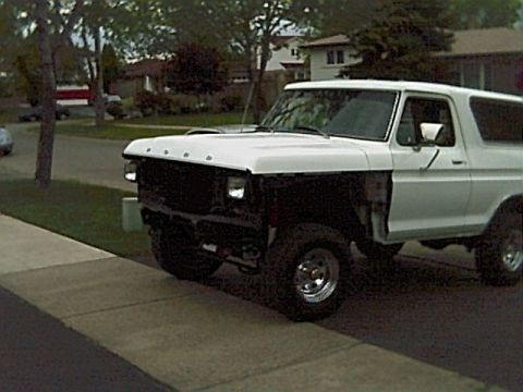 1978 Ford Bronco - This 1978 Ford Bronco is shown from a three-quarter front angle, with its grille and fender removed.