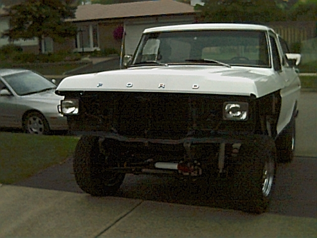 White 1978 Ford Bronco front view, missing grille