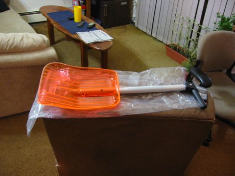 1996 Ford Bronco - An orange plastic part, possibly a lens or cover, is shown with a white handle attached.