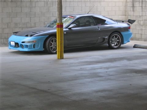 1993 Ford Probe - A modified 1993 Ford Probe is seen from a three-quarter front angle, parked indoors.