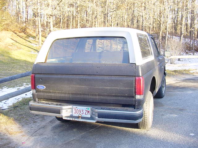Black 1992-96 Ford Bronco with white roof, rear view, Massachusetts plate 3093 ZM