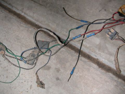 1984 Ford Bronco - A close-up view of a vehicle's wiring harness, showing various wires and connectors.