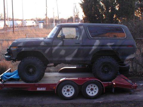 1979 Ford Bronco - This 1979 Ford Bronco, painted in camouflage, is seen loaded onto a trailer.