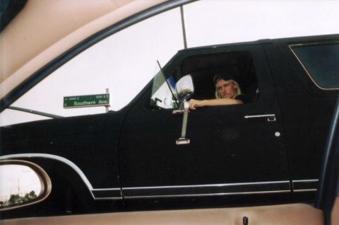 1984 Ford Bronco - Person sits in a black SUV near a street sign for Southern Ave.
