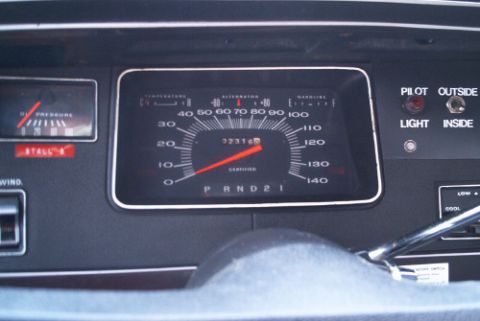 1991 Ford LTD Crown Victoria - Car gauge cluster showing a speedometer marked to 140, oil pressure and fuel gauges, and a PRND21 automatic gear indicator.