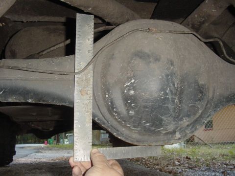 1989 Ford Bronco - Measuring the clearance of the rear differential with a ruler.