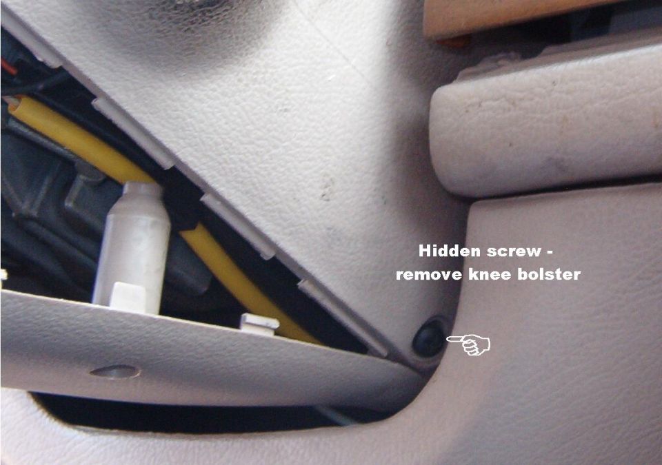If this screw is installed, remove the knee bolster & then the screw.