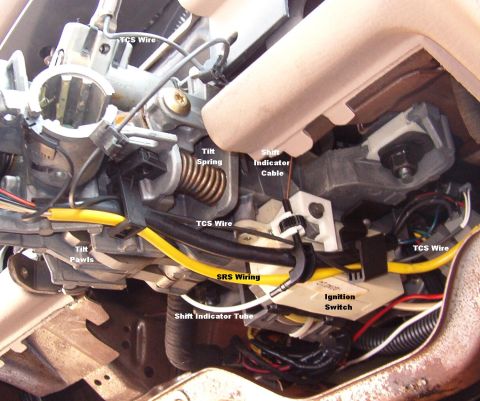 1994 Ford Crown Victoria - Trace the Transmission Control Switch (TCS) wire from the shift lever to its connector, & disconnect it. The larger black harness is the ot…