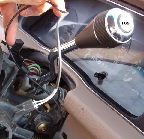 1994 Ford Crown Victoria - Remove the wire from its guides & retainers so it's free all the way to the base of the shift lever.