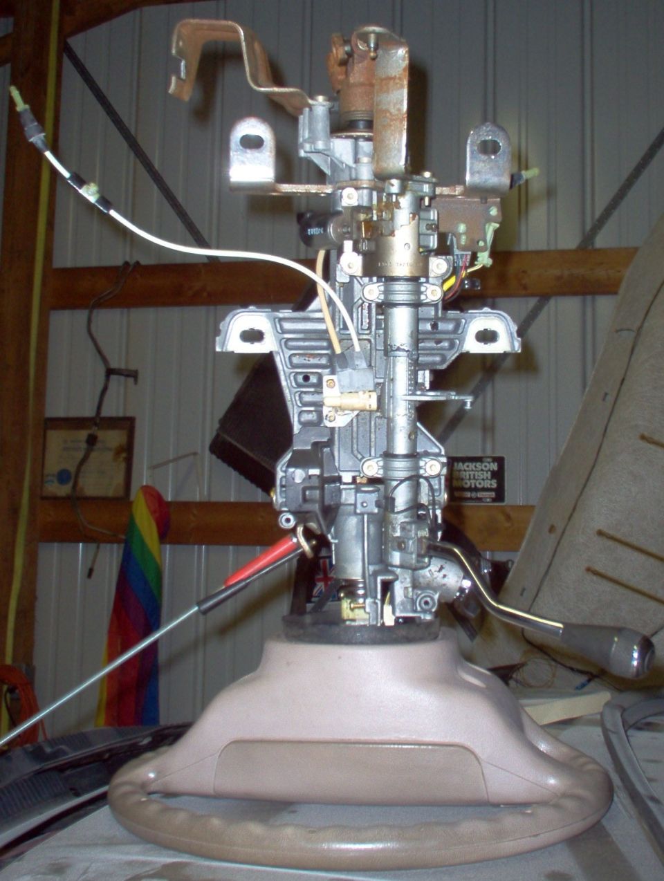 This steering column was used on almost every Ford/L/M product (and some imports) from the early 90s to today.  Some of the bolt-on options changed over the years, but the basic column assembly is the same.  The only significant change I've found is the location of the indexing flat where the steering wheel mounts.  It was moved about 90° at some point, but the wrong steering wheel can still be installed correctly by simply filing another spline or 3 into its bore so it can be rotated on the shaft to the correct position.  Failure to do this would result in the wheel being 90° off while driving, or (after an alignment) less steering travel to one side than the other.